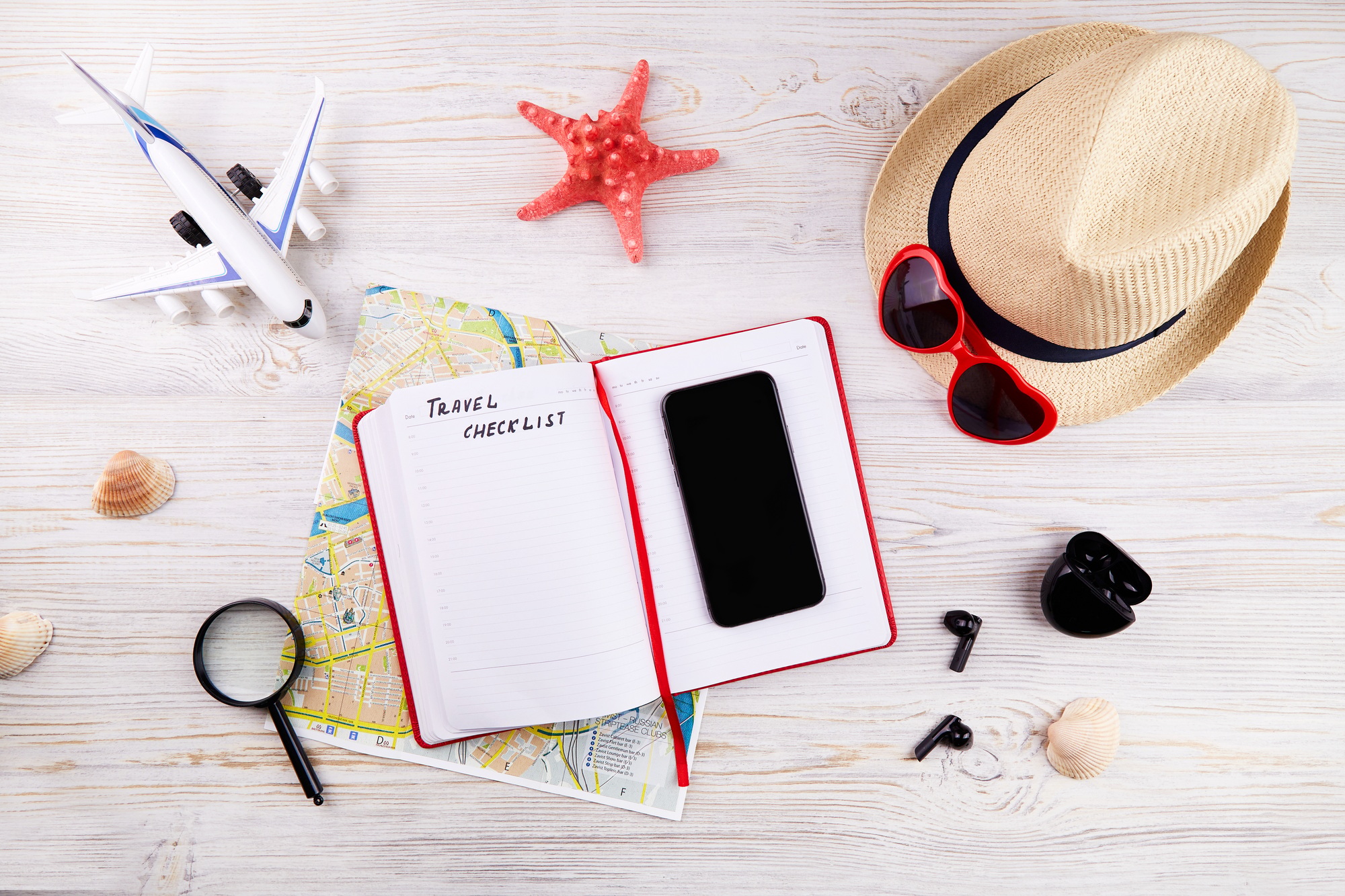 Travel checklist concept. Map, phone, notebook for to do list